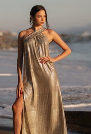 Sparkle in this stunning Grecian Lamé One Shoulder Gown. Crafted from luxurious lamé Viscose fabric, this flowey and luminous gown is perfect for any special occasion. Featuring a side slit and one shoulder design, you'll feel comfortable and gorgeous in this resort-ready gown. Feel divine in this must-have dress!